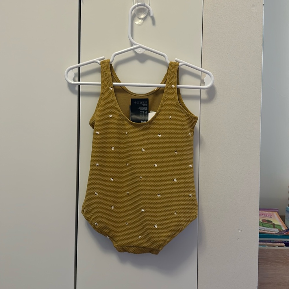 NWT super cute mustard yellow swimsuit with simple floral touches. H&M, 9-12M